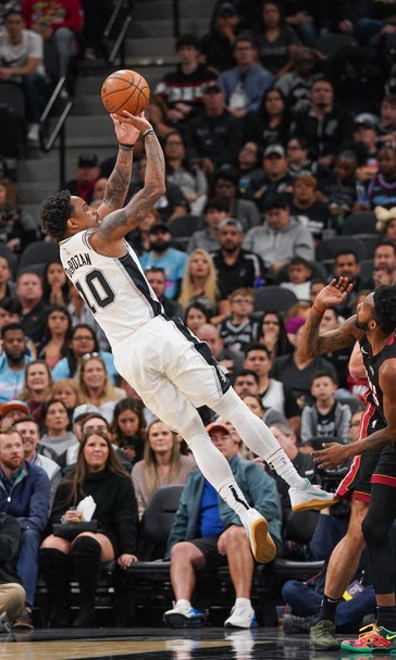Aldridge, DeRozan help Spurs escape to beat Heat 107-102